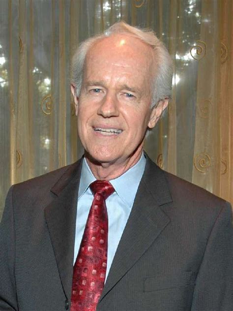 Mike Farrell with his colleagues