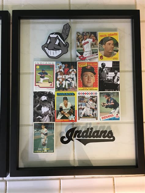 A person looking at baseball card frame ideas