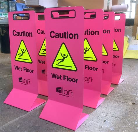 Glow-in-the-dark wet floor signs