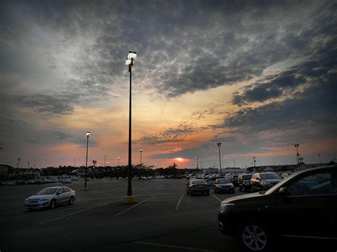 Description of a parking lot diorama at dusk