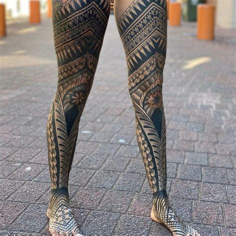 Tribal pattern leg sleeve tattoo