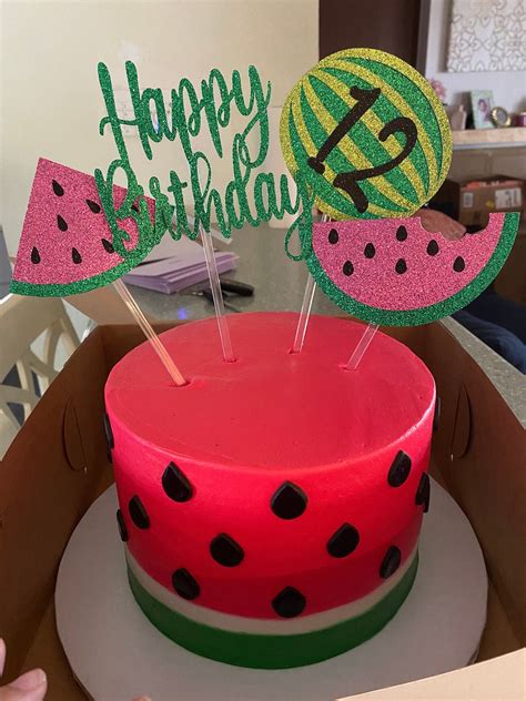 Watermelon cake toppers on a cake